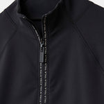 Close-up of Cloudline 1/2 Zip Long Sleeve Top in Black showing zipper detail 1