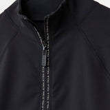 Close-up of Cloudline 1/2 Zip Long Sleeve Top in Black showing zipper detail 1