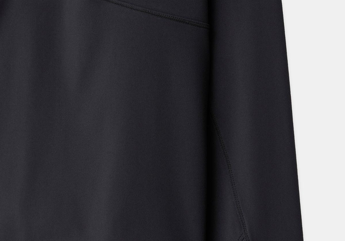 Cloudline 1/2 Zip Long Sleeve Top in Black – Sleeve and Hem Detail