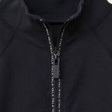 Close-up of the Cloudline Long Sleeve in black with a zipper and VALA branding.