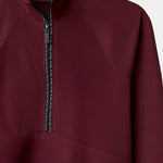 Cloudline 1/2 Zip Long Sleeve Top in Deep Cherry – Close-Up of Front Zipper and Seam Detail