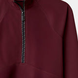 Cloudline 1/2 Zip Long Sleeve Top in Deep Cherry – Close-Up of Front Zipper and Seam Detail