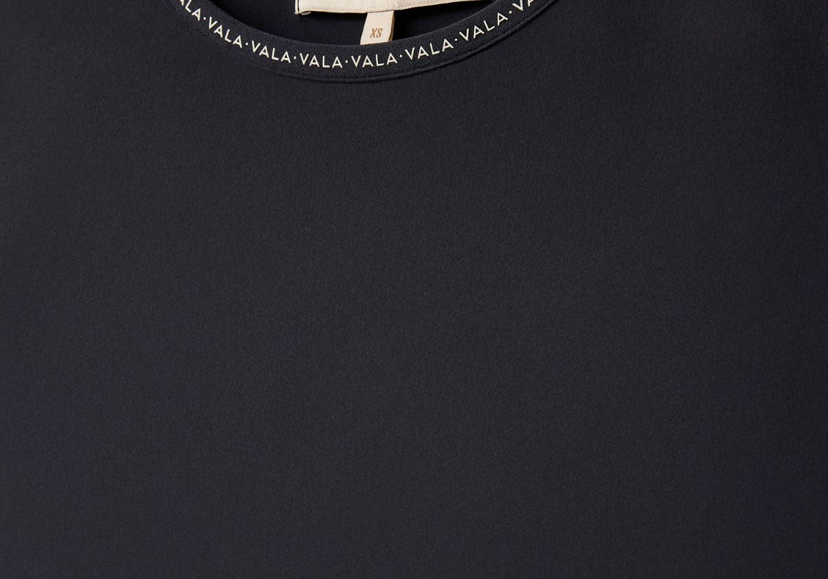 Cloudline Long Sleeve Top in Black – Close-Up of Neckline and VALA Logo Detail
