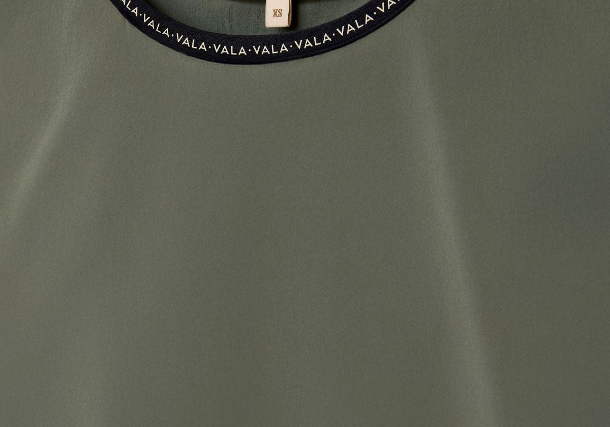 Cloudline Long Sleeve Top in Clover – Close-Up of Neckline and VALA Logo Detail