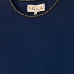 Cloudline Long Sleeve Top in Navy – Close-Up of Neckline and VALA Logo Detail