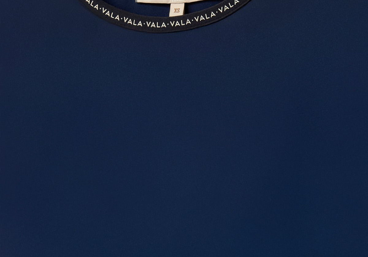 Cloudline Long Sleeve Top in Navy – Close-Up of Neckline and VALA Logo Detail