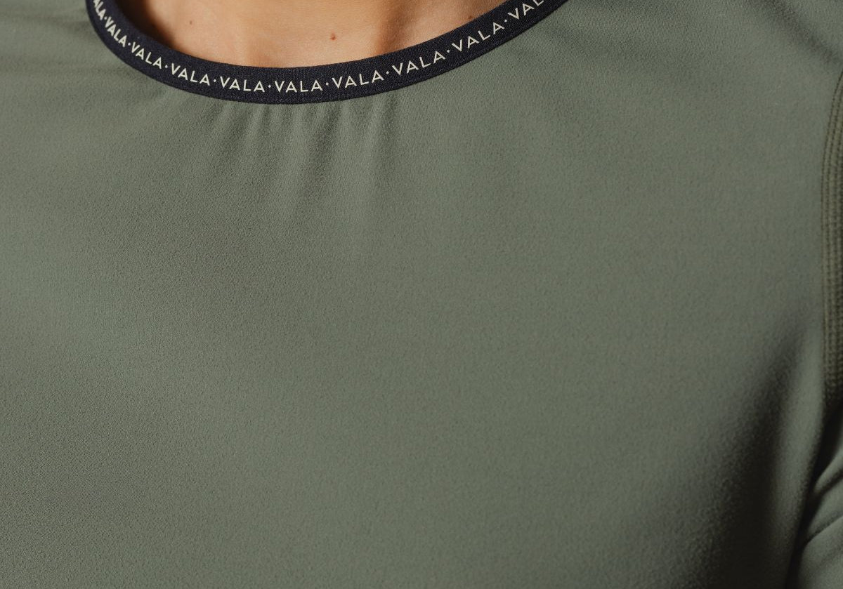 Cloudline Long Sleeve Top in Clover – Close-Up of Collar and VALA Logo Detail